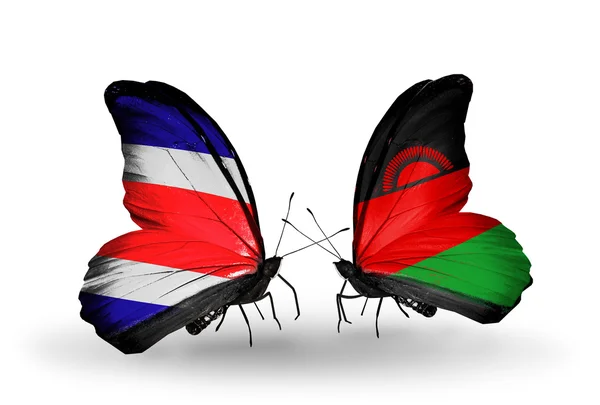 Schmetterlinge mit Costa Rica- und Malawi-Flaggen auf Flügeln — Stockfoto
