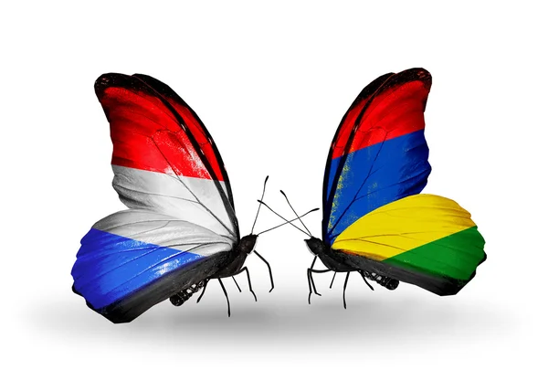 Butterflies with Luxembourg and  Mauritius  flags on wings — Stock Photo, Image