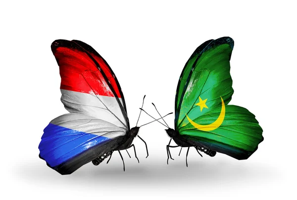 Butterflies with Luxembourg and  Mauritania flags on wings — Stock Photo, Image