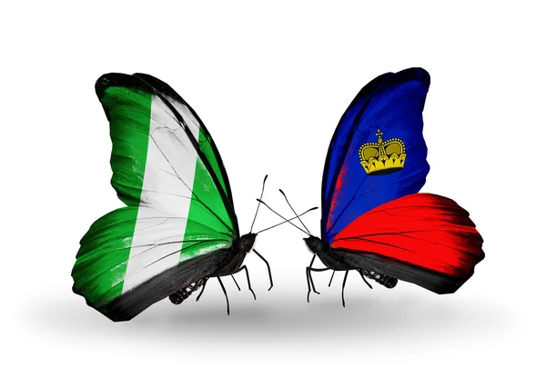 Butterflies with Nigeria and Liechtenstein flags on wings — Stock Photo, Image