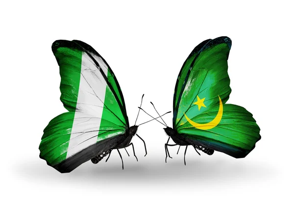 Mariposas con banderas de Nigeria y Mauritania en alas — Foto de Stock