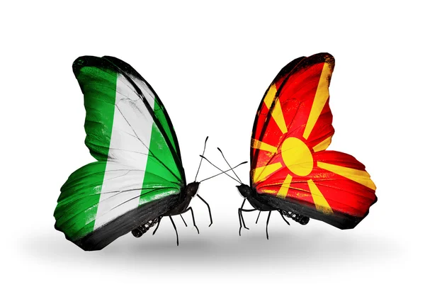 Butterflies with Nigeria and Macedonia flags on wings — Stock Photo, Image