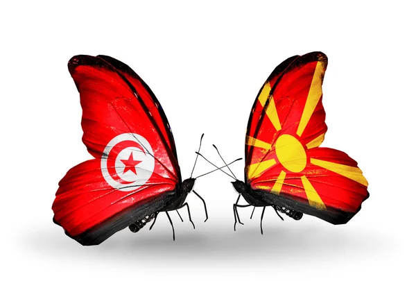 Farfalle con bandiere Tunisia e Macedonia sulle ali — Foto Stock