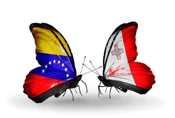 Papillons avec drapeaux Venezuela et Malte sur les ailes — Photo