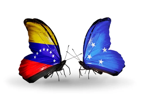 Schmetterlinge mit Venezuela- und Mikronesien-Flaggen auf Flügeln — Stockfoto