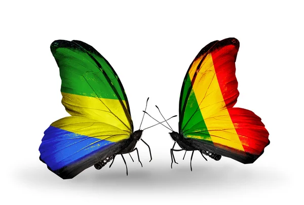Kelebek kanatları üzerinde gabon ve mali bayraklı — Stok fotoğraf