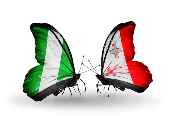 Butterflies with Nigeria and Malta flags on wings — Stock Photo, Image