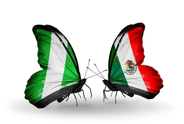 Butterflies with Nigeria and Mexico flags on wings — Stock Photo, Image