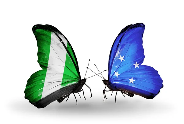 पंख वर नायजेरिया आणि मायक्रोनेशिया ध्वज सह फुलपाखरू — स्टॉक फोटो, इमेज