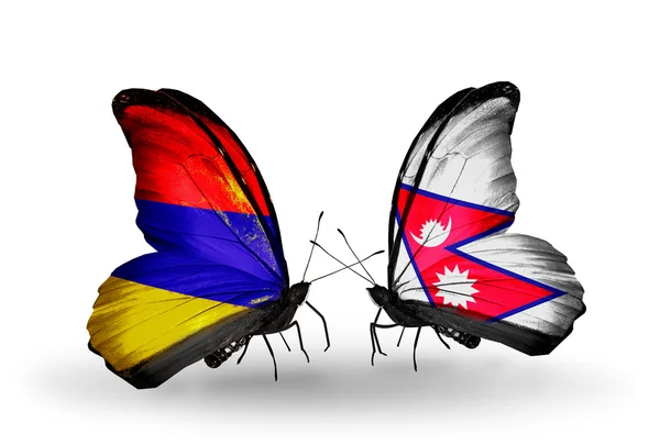 Motýli s Arménií a Nepál vlajky na křídlech — Stock fotografie