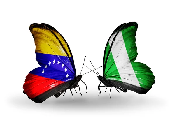 Бабочки с флагами Венесуэлы и Нигерии на крыльях — стоковое фото