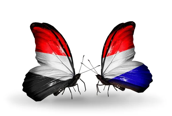 Butterflies with Yemen and  Holland flags on wings — Stock Photo, Image