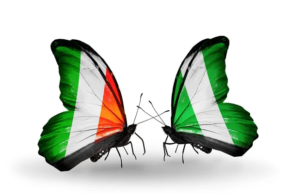 Butterflies with Ireland and Nigeria flags on wings — Stock Photo, Image