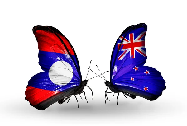 Mariposas con banderas de Laos y Nueva Zelanda en alas — Foto de Stock