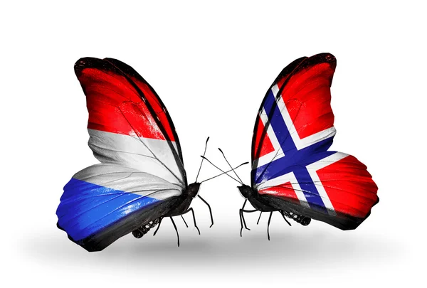 Papillons avec drapeaux Luxembourg et Norvège sur les ailes — Photo