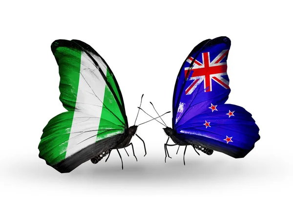 Butterflies with Nigeria and New Zealand flags on wings — Stock Photo, Image