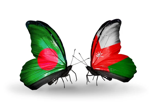 Vlinders met bangladesh en oman vlaggen op vleugels — Stockfoto