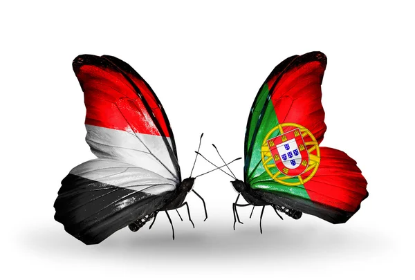 Borboletas com bandeiras do Iêmen e de Portugal em asas — Fotografia de Stock
