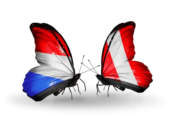 Butterflies with Luxembourg and Peru flags on wings — Stock Photo, Image