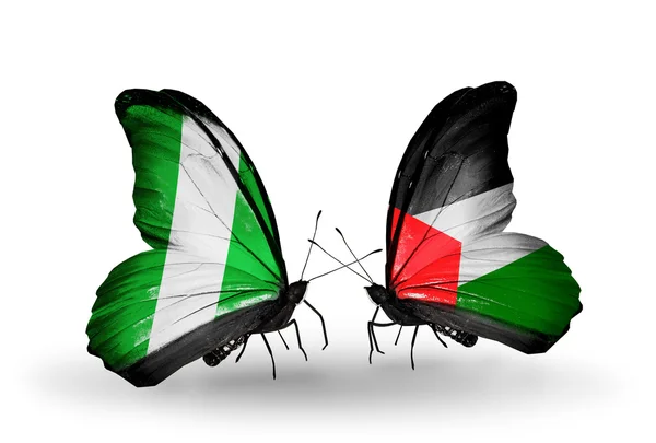 Vlinders met nigeria en Palestina vlaggen op vleugels — Stockfoto