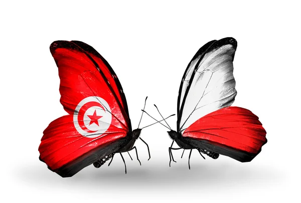 Papillons avec drapeaux Tunisie et Pologne sur les ailes — Photo