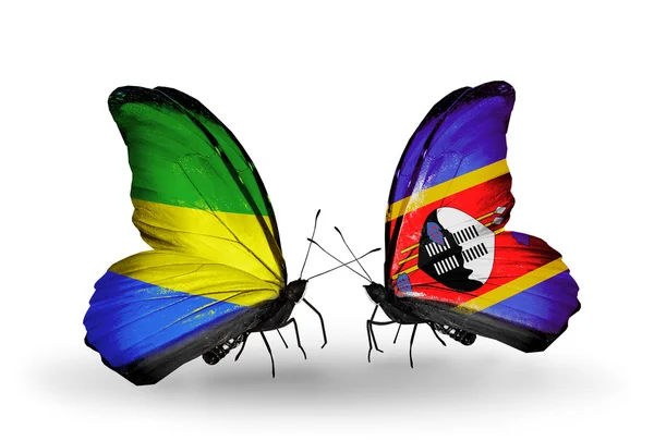 Butterflies with Gabon and Swaziland flags on wings — Stock Photo, Image