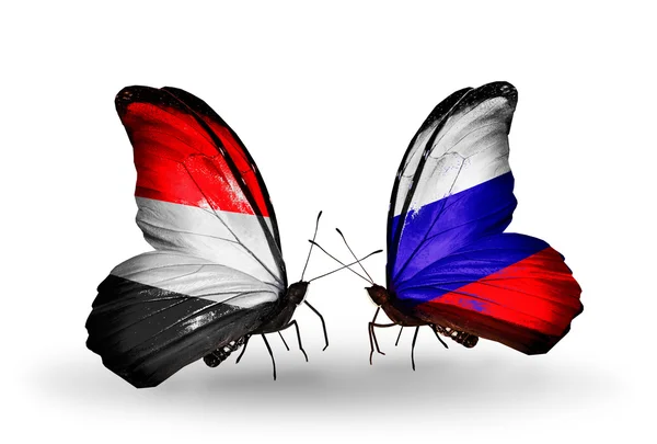 Butterflies with Yemen and  Russia flags on wings — Stock Photo, Image