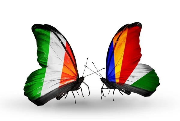 Butterflies with Ireland and Seychelles flags on wings — Stock Photo, Image