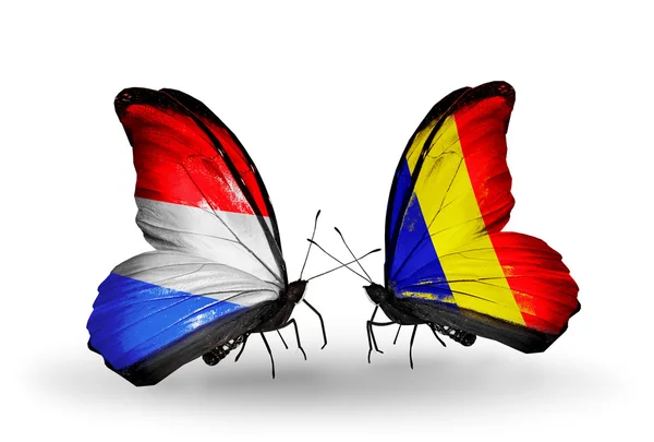 Butterflies with Luxembourg and Chad, Romania flags on wings — Stock Photo, Image