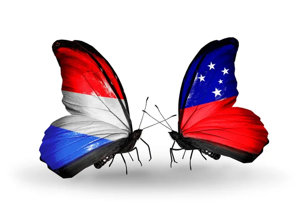 Papillons avec drapeaux Luxembourg et Samoa sur les ailes — Photo