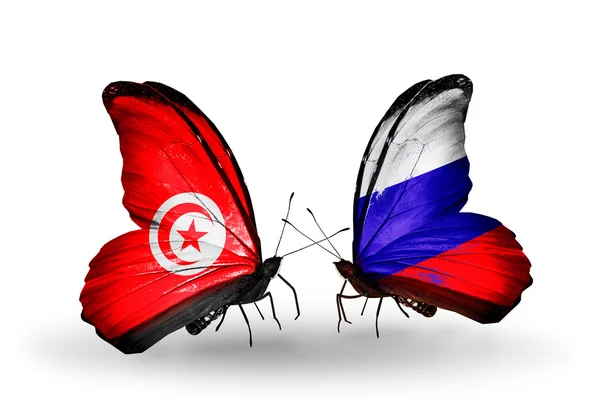 Butterflies with Tunisia and Russia flags on wings — Stock Photo, Image