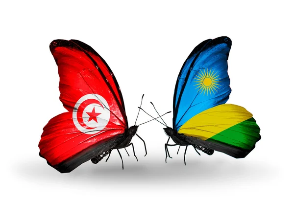 Papillons avec drapeaux Tunisie et Rwanda sur les ailes — Photo