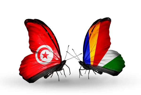 Butterflies with Tunisia and Seychelles flags on wings — Stock Photo, Image