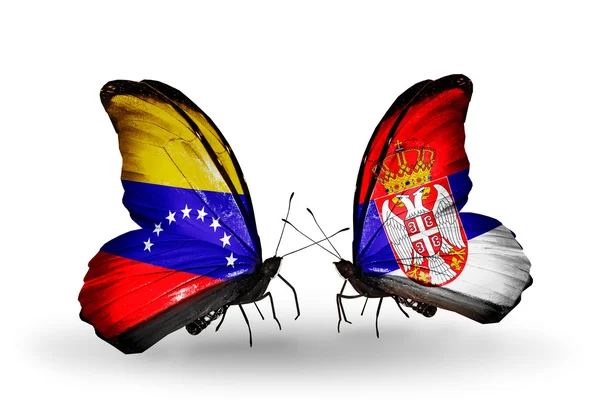 Butterflies with Venezuela and Serbia flags on wings — Stock Photo, Image