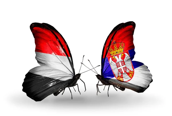 Butterflies with Yemen and Serbia flags on wings — Stock Photo, Image