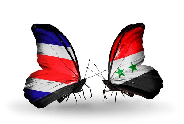 Papillons avec des drapeaux du Costa Rica et de Syrie sur les ailes — Photo