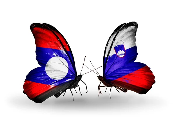 Butterflies with Laos and Slovenia flags on wings — Stock Photo, Image