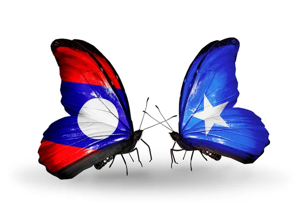 Butterflies with Laos and Somalia flags on wings — Stock Photo, Image