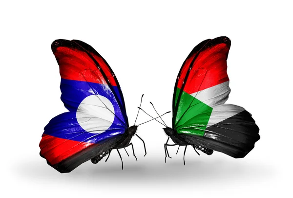Mariposas con banderas de Laos y Sudán en alas — Foto de Stock
