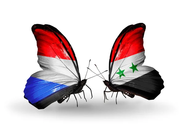 Papillons avec drapeaux Luxembourg et Syrie sur les ailes — Photo