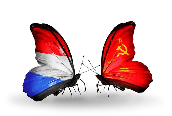 Butterflies with Luxembourg and  Soviet Union flags on wings — Stock Photo, Image