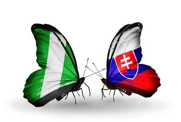 Motyle z Nigerii i Słowacji flagi na skrzydłach — Zdjęcie stockowe