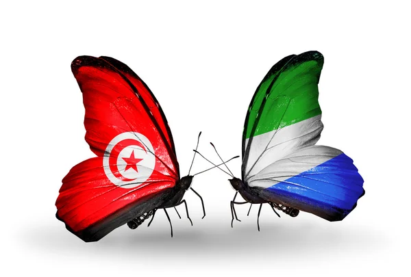 Butterflies with Tunisia and Sierra Leone flags on wings — Stock Photo, Image