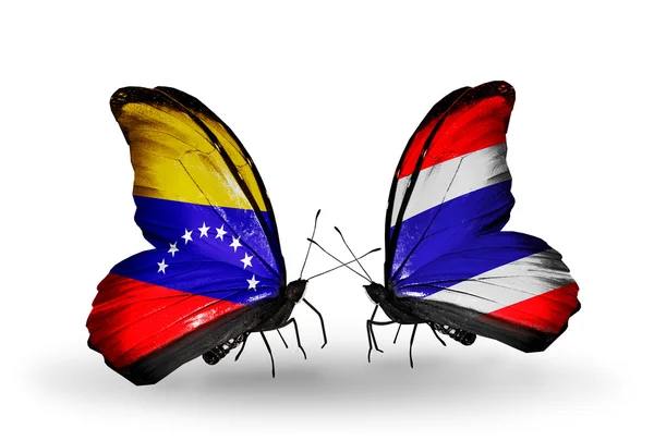 Kelebekler kanat venezuela ve Tayland bayrakları ile — Stok fotoğraf