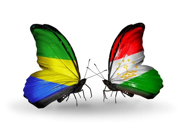 Butterflies with Gabon and Tajikistan flags on wings — Stock Photo, Image