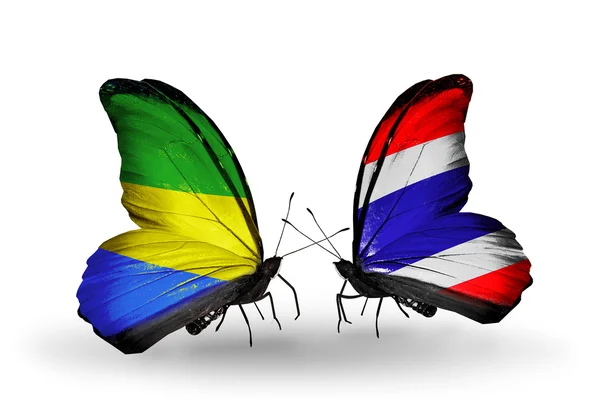 Mariposas con banderas de Gabón y Tailandia en alas —  Fotos de Stock