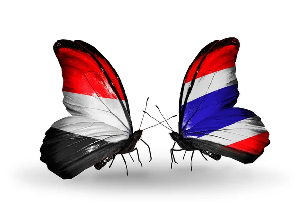 Butterflies with Yemen and Thailand flags on wings — Stock Photo, Image