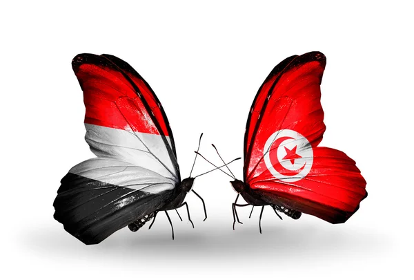 Butterflies with Yemen and Tunisia flags on wings — Stock Photo, Image