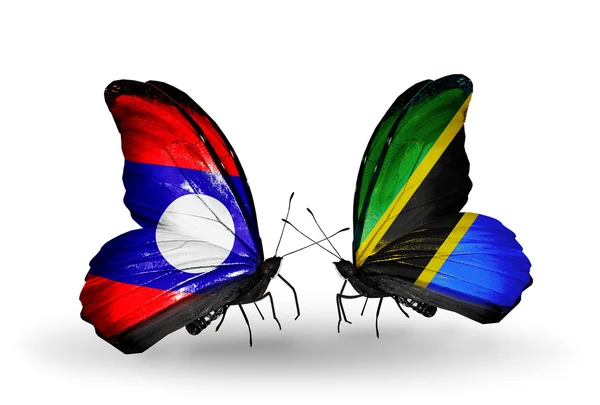 Mariposas con banderas de Laos y Tanzania en alas — Foto de Stock