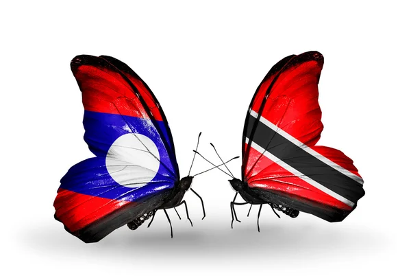 Motyle z flagi Laosu i Trynidad i tobago na skrzydłach — Zdjęcie stockowe